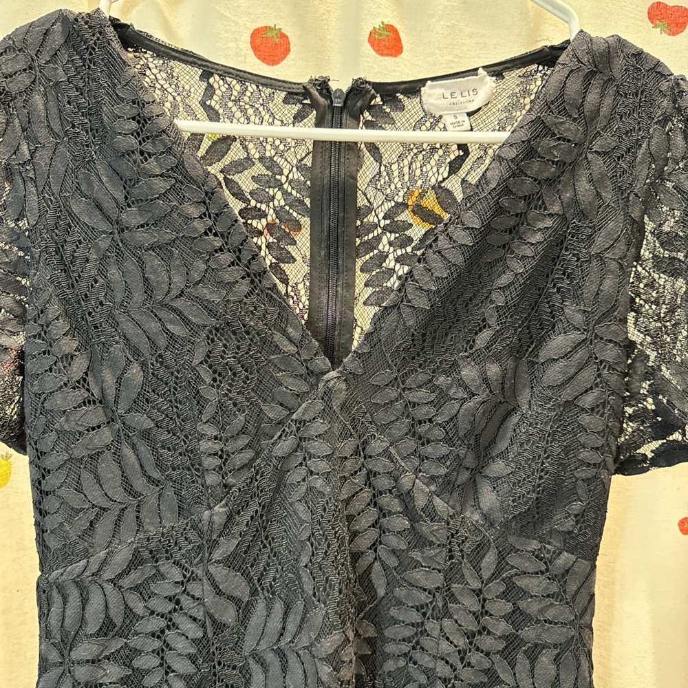 Short, laced-backed, black dress